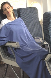 Woman sleeping on plane.